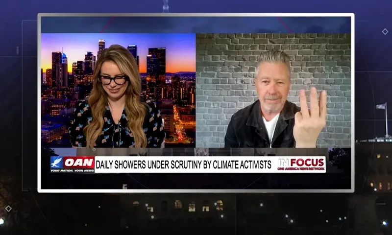 Video still from In Focus on One America News Network showing a split screen of the host on the left side, and on the right side is the guest, Michael Loftus.
