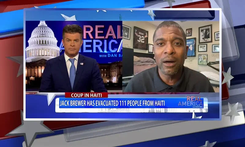 Video still from Real America on One America News Network showing a split screen of the host on the left side, and on the right side is the guest, Jack Brewer.