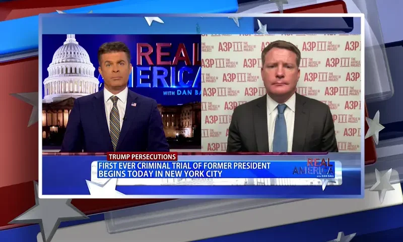 Video still from Real America on One America News Network showing a split screen of the host on the left side, and on the right side is the guest, Mike Davis.