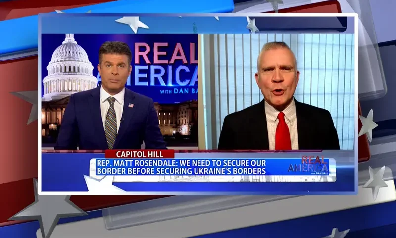 Video still from Real America on One America News Network showing a split screen of the host on the left side, and on the right side is the guest, Matt Rosendale.