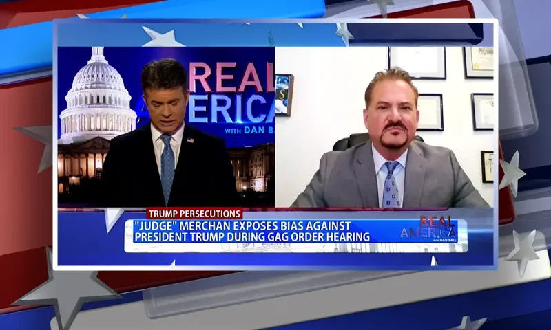 Video still from Real America on One America News Network showing a split screen of the host on the left side, and on the right side is the guest, David Wohl.