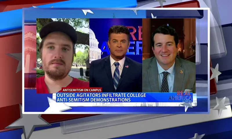 Video still from Real America on One America News Network during an interview with the guests, Alex Stein and Nick Sortor.