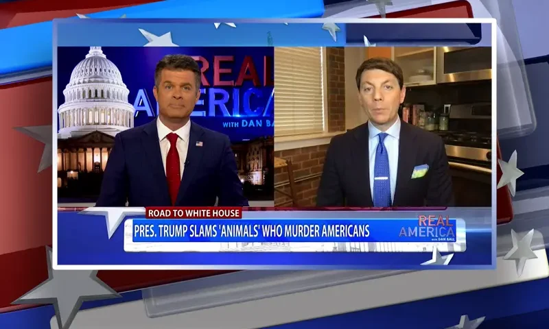 Video still from Real America on One America News Network showing a split screen of the host on the left side, and on the right side is the guest, Hogan Gidley.