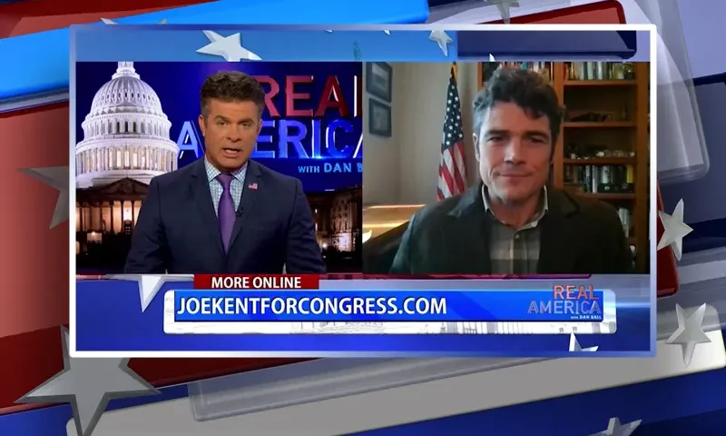 Video still from Real America on One America News Network showing a split screen of the host on the left side, and on the right side is the guest, Joe Kent.