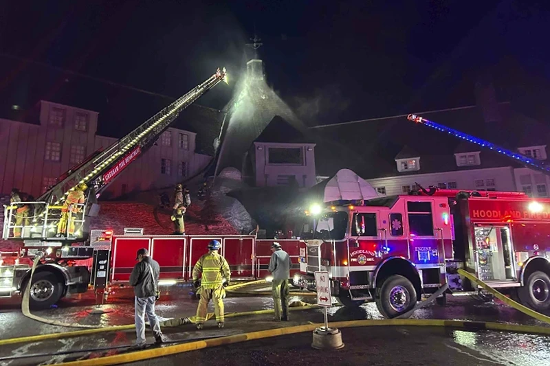 4 of 5 | Firefighters extinguish a fire at Oregon's historic Timberline Lodge, which was featured in Stanley Kubrick's 1980 film "The Shining," Thursday evening, April 18, 2024, in Government Camp, Ore. (Clackamas Fire Department via AP)