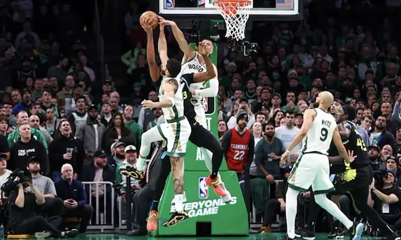 Boston Celtics forward Jayson Tatum (0) and Boston Celtics center Kristaps Porzingis (8) block Indiana Pacers center Myles Turner (33) during the second half at TD Garden. Mandatory Credit: Paul Rutherford-USA TODAY Sports/File Photo
