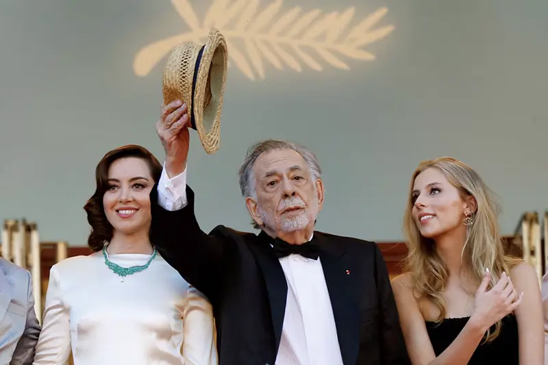 Director Francis Ford Coppola poses on the red carpet with cast members Aubrey Plaza and Romy Coppola, during arrivals for the screening of the film "Megalopolis" in competition at the 77th Cannes Film Festival in Cannes, France, May 16, 2024. REUTERS/Clodagh Kilcoyne