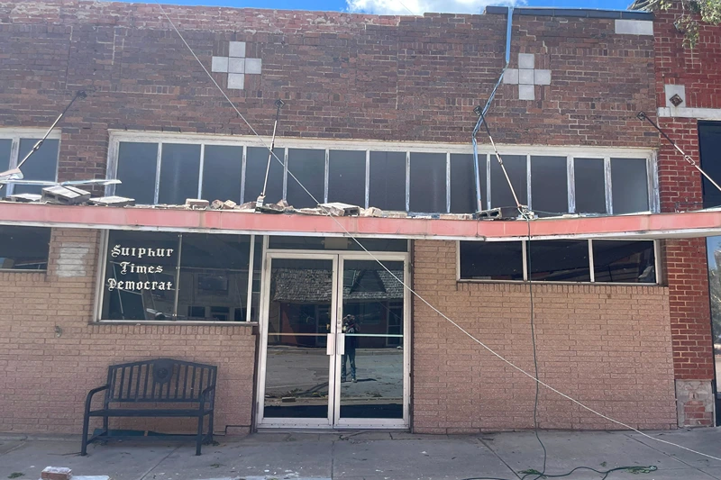 Damage surrounds the Sulphur Times-Democrat building on Monday, April 29, 2024, after a tornado plowed through the rural Oklahoma community and left wide destruction through downtown Sulphur, Oka. (AP Photo/Graham Lee Brewer)