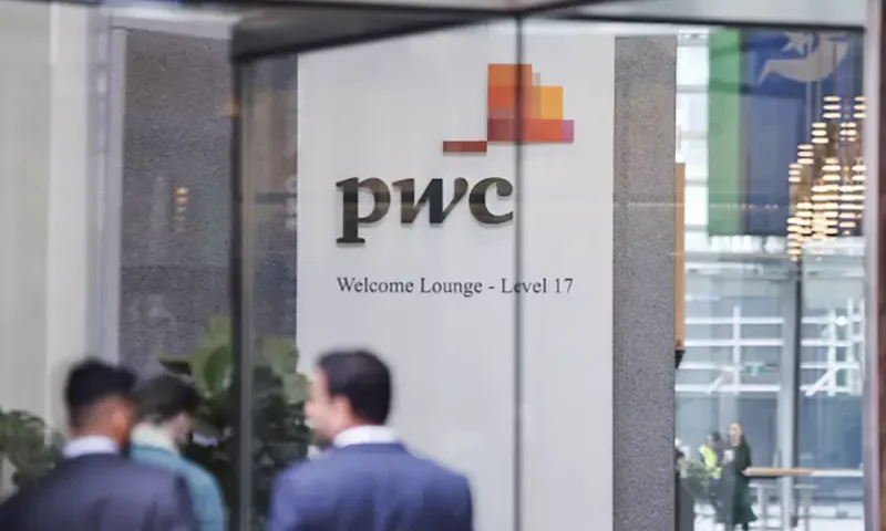 PwC sign is seen in the lobby of their offices in Barangaroo, Australia June 22, 2023. REUTERS/Lewis Jackson/ file photo