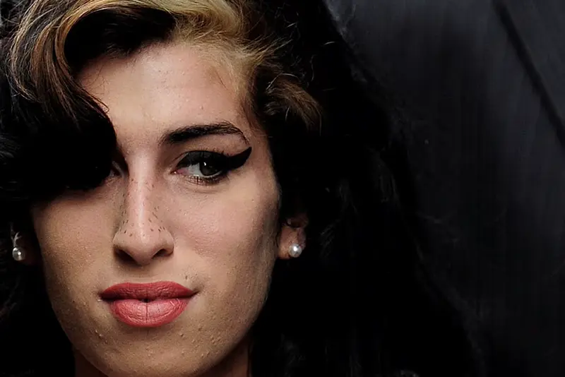 British singer Amy Winehouse arrives at Westminster Magistrates Court in central London July 23, 2009. REUTERS/Toby Melville/File Photo