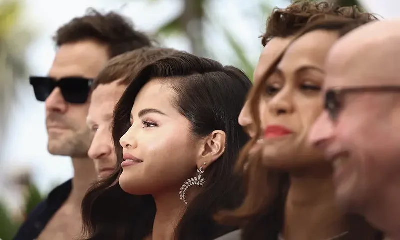 Director Jacques Audiard and cast members Edgar Ramirez, Zoe Saldana and Selena Gomez pose during a photocall for the film "Emilia Perez" in competition at the 77th Cannes Film Festival in Cannes, France, May 19, 2024. REUTERS/Yara Nardi