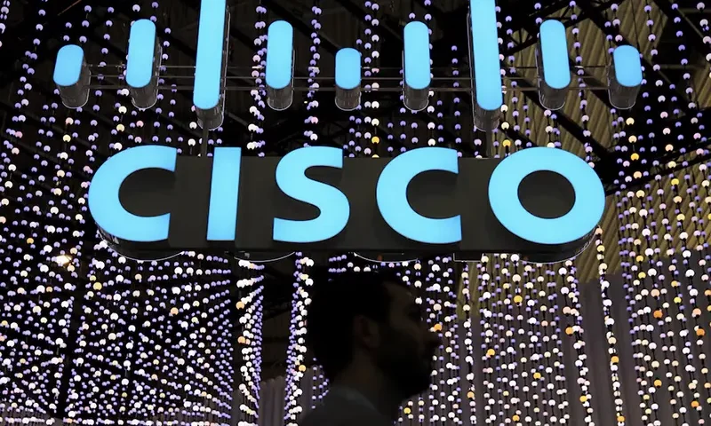 A man passes under a Cisco logo at the Mobile World Congress in Barcelona, Spain February 25, 2019. REUTERS/Sergio Perez/File Photo