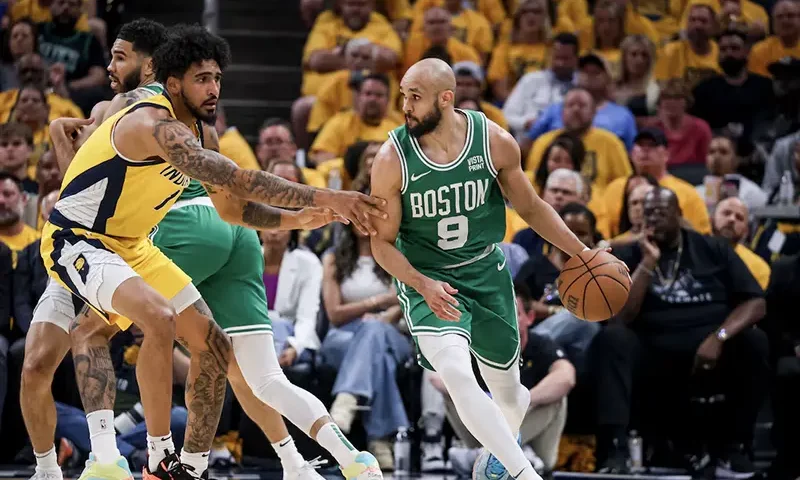 Boston Celtics guard Derrick White (9) dribbles the ball during the second quarter during game four of the eastern conference finals for the 2024 NBA playoffs at Gainbridge Fieldhouse. Mandatory Credit: Trevor Ruszkowski-USA TODAY Sports