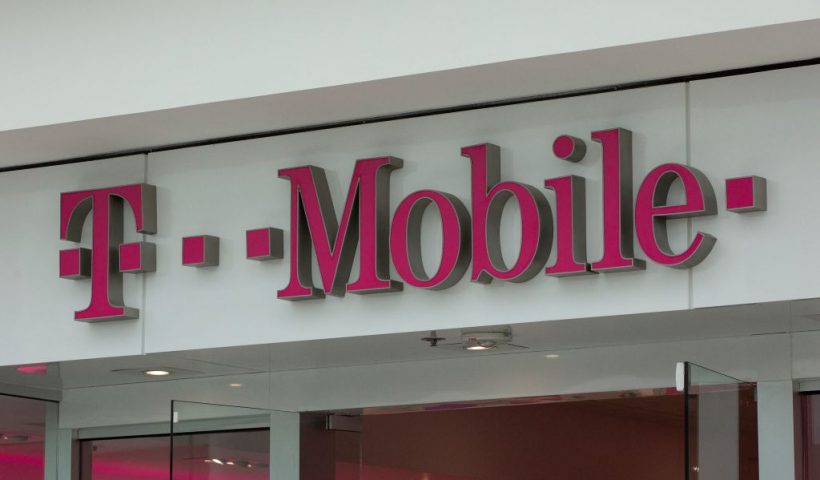 The T-Mobile logo is seen outside a shop in Washington, DC, on July 26, 2019. - US antitrust authorities approved the USD 26 billion merger of T-Mobile and Sprint in a deal that brings together the third- and fourth-largest wireless operators as the industry moves toward deployment of superfast 5G networks. (Photo by Alastair Pike / AFP) (Photo by ALASTAIR PIKE/AFP via Getty Images)