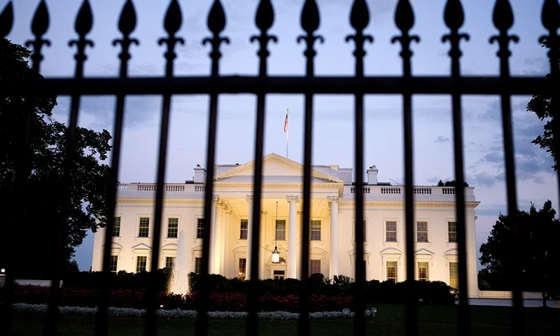 As Default Deadline Nears, Congress Continues Debate Debt Ceiling Plan WASHINGTON, DC - JULY 30: A view of the White House is photographed through the gate on July 30, 2011 in Washington, DC. Republican leaders held fresh talks with U.S. President Barack Obama to try to break a deadlock on raising the debt limit. (Photo by Joshua Roberts/Getty Images)