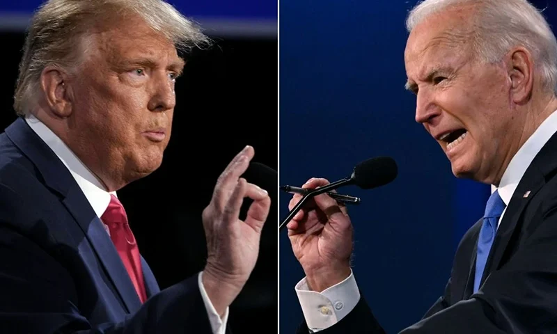 TOPSHOT - (COMBO) This combination of pictures created on October 22, 2020 shows US President Donald Trump (L) and Democratic Presidential candidate and former US Vice President Joe Biden during the final presidential debate at Belmont University in Nashville, Tennessee, on October 22, 2020. (Photo by Brendan Smialowski and JIM WATSON / AFP) (Photo by BRENDAN SMIALOWSKIJIM WATSON/AFP via Getty Images)