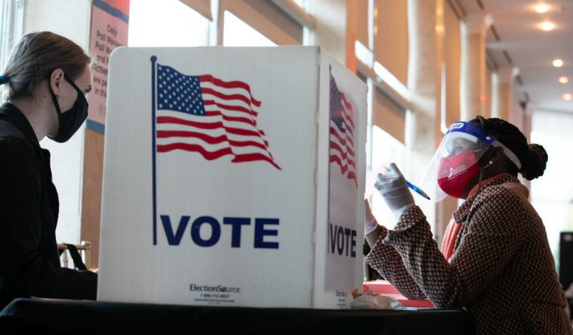 ATLANTA, GA - NOVEMBER 03: A poll worker helps K. Maki (left) fill out a provisional ballot at Park Tavern polling station on November 3, 2020 in Atlanta, Georgia. After a record-breaking early voting turnout, Americans head to the polls on the last day to cast their vote for incumbent U.S. President Donald Trump or Democratic nominee Joe Biden in the 2020 presidential election. (Photo by Jessica McGowan/Getty Images)
