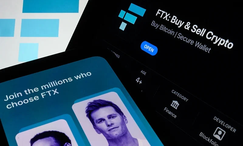 LONDON, ENGLAND - NOVEMBER 10: In this photo illustration the FTX logo and mobile app adverts are displayed on screens on November 10, 2022 in London, England. The Bahamas-based crypto exchange's larger rival, Binance, walked away from a potential bailout deal, as FTX struggles with a wave of customer withdrawals that have created a liquidity crunch. (Photo Illustration by Leon Neal/Getty Images)