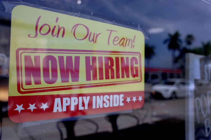 MIAMI, FLORIDA - MAY 05: A 'Now Hiring' sign posted in the window of a restaurant looking to hire workers on May 05, 2023 in Miami, Florida. A report by the Bureau of Labor Statistics showed the US economy added 253,000 jobs in April. (Photo by Joe Raedle/Getty Images)