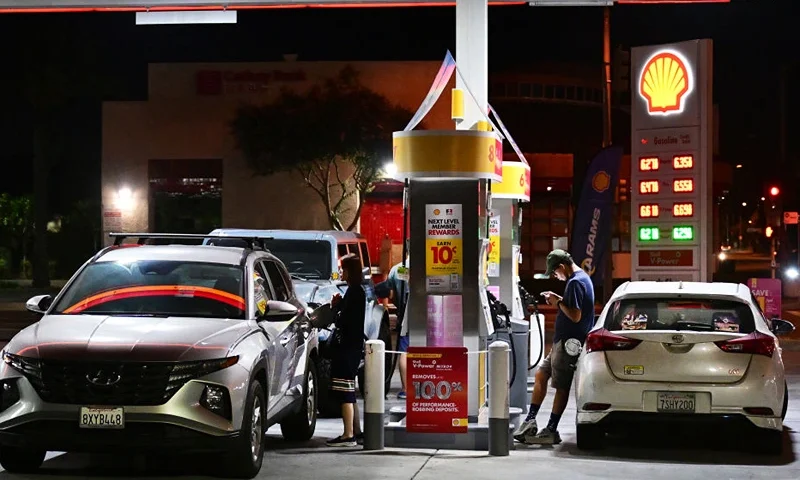 People pump gas into their vehicles at a Shell petrol station on October 2, 2023 in Alhambra, California. Americans are facing higher gas prices despite the Federal Reserve's effort to curb inflation, with rates at their highest in over two decades, as Brent crude oil prices have risen more than 30% in the past three months. (Photo by Frederic J. BROWN / AFP) (Photo by FREDERIC J. BROWN/AFP via Getty Images)