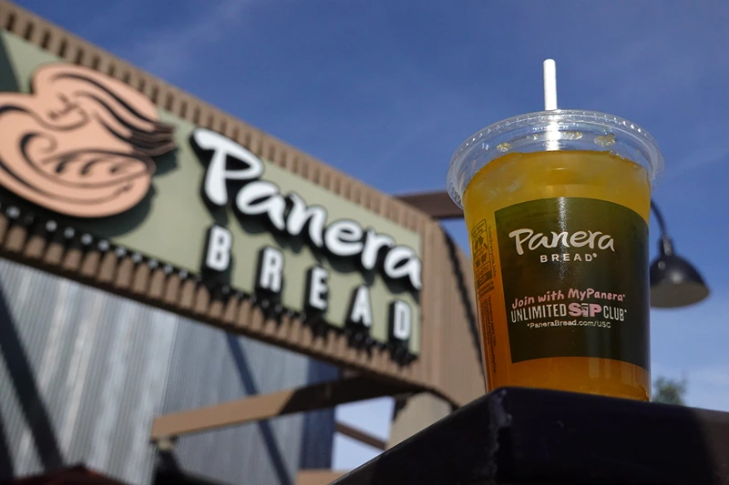 Panera Bread To Layoff 17 Percent Of Executives
NOVATO, CALIFORNIA - NOVEMBER 01: In this photo illustration, a Panera Bread mango yuzu citrus charged lemonade is displayed at a Panera Bread restaurant on November 01, 2023 in Novato, California. Missouri based Panera Bread announced plans to lay off 17 percent of its 1800 corporate staff as the company streamlines its operations ahead of an initial public offering. (Photo illustration by Justin Sullivan/Getty Images)