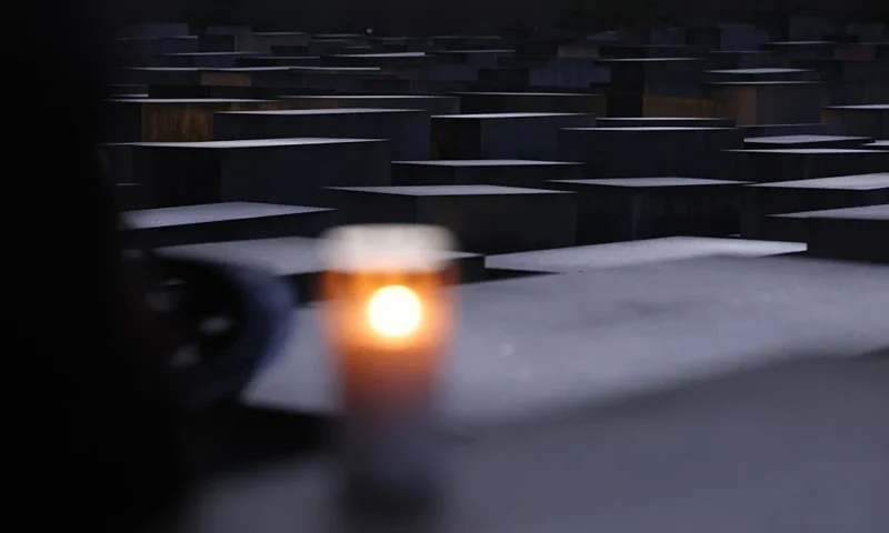 BERLIN, GERMANY - JANUARY 26: A candle stands among stelae at the Memorial to the Murdered Jews of Europe, also called the Holocaust Memorial, on the eve of International Holocaust Remembrance Day on January 26, 2024 in Berlin, Germany. Tomorrow will be the 79th anniversary of the liberation of the Auschwitz concentration camp, the biggest of the many concentration camps used by the Nazis during World War II to enslave and exterminate millions of Jews, political opponents, Roma and other Nazi-deemed undesirables. (Photo by Sean Gallup/Getty Images)