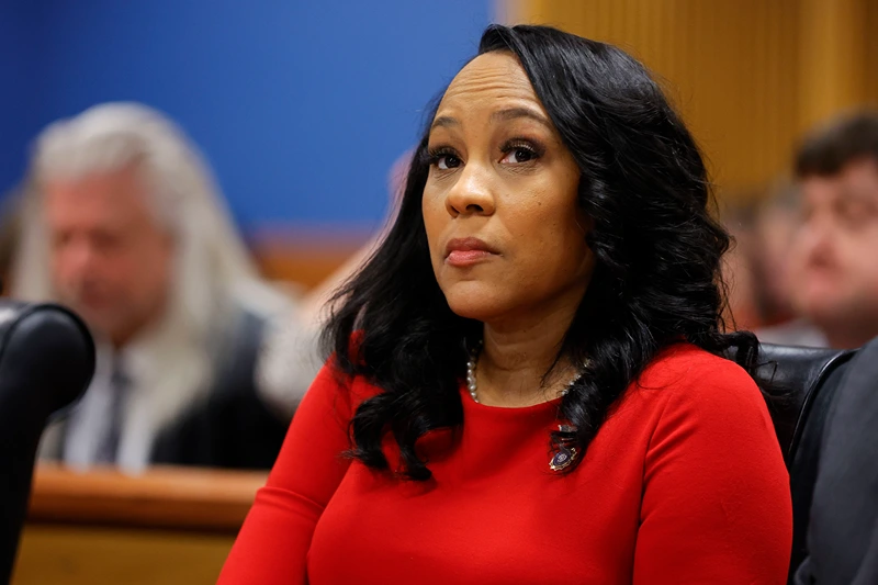 US-JUSTICE-POLITICS-TRUMP-GEORGIA
Fulton County District Attorney Fani Willis arrives for the final arguments in her disqualification hearing at the Fulton County Courthouse on March 1, 2024, in Atlanta, Georgia. Fulton County Superior Judge Scott McAfee is considering a motion to disqualify Willis over her romantic relationship with Special Prosecutor Nathan Wade, whom she appointed as special prosecutor in the election interference charges against former president Donald Trump. (Photo by Alex Slitz / POOL / AFP) (Photo by ALEX SLITZ/POOL/AFP via Getty Images)