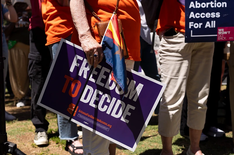 Arizona's Supreme Court Revives 1864 Law Banning Abortions, Causing Backlash
PHOENIX, ARIZONA - APRIL 17: Members of Arizona for Abortion Access, the ballot initiative to enshrine abortion rights in the Arizona State Constitution, hold a press conference and protest condemning Arizona House Republicans and the 1864 abortion ban during a recess from a legislative session at the Arizona House of Representatives on April 17, 2024 in Phoenix, Arizona. Arizona House Republicans blocked the Democrats from holding a vote to overturn the 1864 abortion ban revived last week by the Arizona Supreme Court. (Photo by Rebecca Noble/Getty Images)
