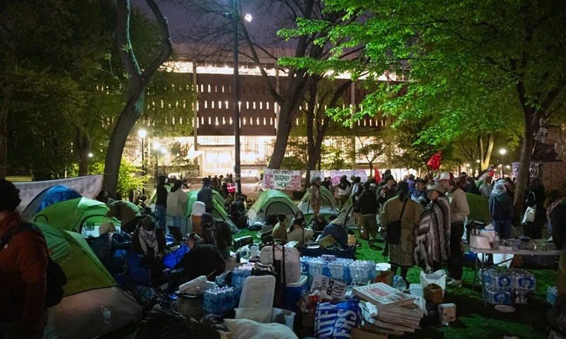Pro-Palestinian students and faculty of Drexel University, Temple University and the University of Pennsylvania demonstrate as they spend night where they erected an encampment at the University of Pennsylvania campus in Philadelphia on April 25, 2024. College campuses across the US braced for fresh protests by pro-Palestinian students, extending a week of increasingly confrontational standoffs with police, mass arrests and accusations of anti-Semitism. (Photo by Matthew Hatcher / AFP) (Photo by MATTHEW HATCHER/AFP via Getty Images)