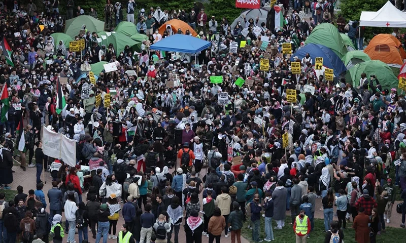 WASHINGTON, DC - APRIL 25: Activists and students participate in an encampment protest at the University Yard at George Washington University on April 25, 2024 in Washington, DC. Student Activists at George Washington University have joined a range of campuses across the United States who have started encampments to call on their universities to divest financial ties from Israel. (Photo by Alex Wong/Getty Images)