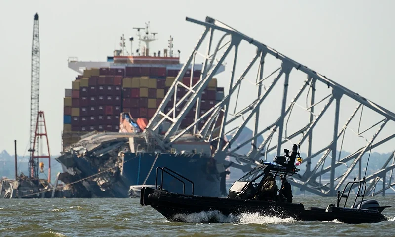 A Maryland Transportation Authority patrol boat makes a pass in the waters of the Patapco river near where crews were getting ready to conduct a controlled demolition of a section of the Francis Scott Key Bridge resting on the Dali container ship in Baltimore on May 13, 2024. The Francis Scott Key Bridge, a major transit route into the busy port of Baltimore, collapsed on March 26 when the Dali container ship lost power and collided into a support column, killing six roadway construction workers. (Photo by ROBERTO SCHMIDT / AFP) (Photo by ROBERTO SCHMIDT/AFP via Getty Images)