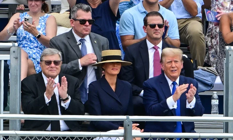 Former US President Donald Trump (R), with former First Lady Melania Trump (C) and her father Viktor Knavs (L), attends the graduation ceremony of his son, Barron Trump, at Oxbridge Academy in Palm Beach, Florida, May 17, 2024. (Photo by Giorgio VIERA / AFP) (Photo by GIORGIO VIERA/AFP via Getty Images)