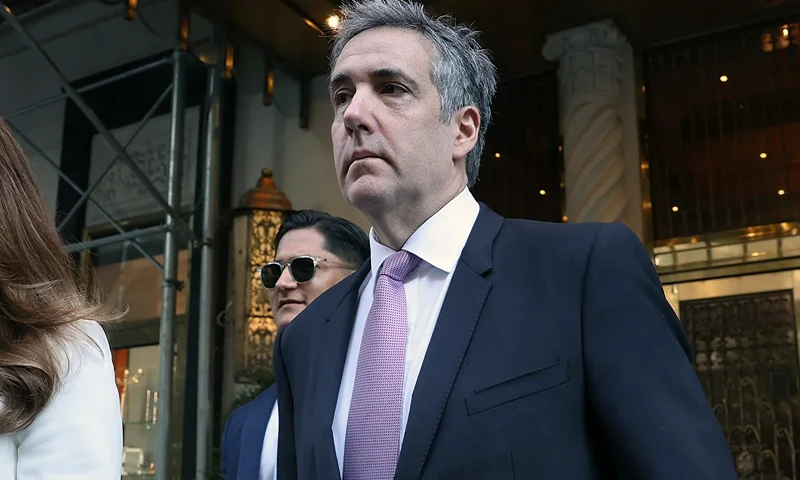 NEW YORK, NEW YORK - MAY 20: Michael Cohen, former personal lawyer to Donald Trump, and attorney Danya Perry leave his apartment building on his way to Manhattan criminal court in New York on May 20, 2024. Cohen, while taking the witness stand in the Manhattan criminal trial, directly connected Donald Trump to the hush-money payment to adult-film actress Stormy Daniels to keep their alleged sexual encounter out of the news ahead of the 2016 election. (Photo by Spencer Platt/Getty Images)