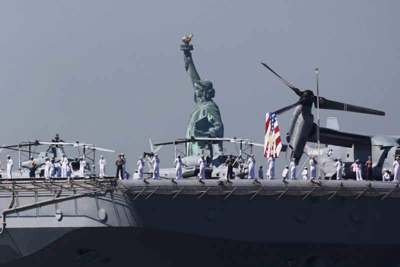 NEW YORK, NEW YORK - MAY 22: The USS Bataan (LHD-5) sails past the Statue of Liberty as it arrives with the Parade of Ships into New York Harbor during the start of the 36th annual Fleet Week on May 22, 2024 in New York City. The ships travel past the Statue of Liberty and Battery Park in lower Manhattan before ending just below the George Washington Bridge. Fleet Week brings thousands of active service members to New York City for a week of ship tours, concerts, demonstrations and other events that give New Yorkers a close up view of the U.S. military. (Photo by Spencer Platt/Getty Images)