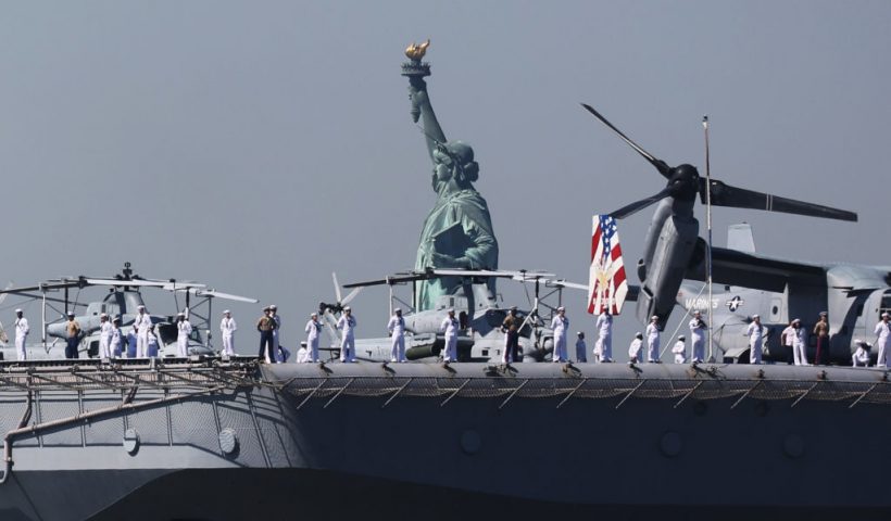 NEW YORK, NEW YORK - MAY 22: The USS Bataan (LHD-5) sails past the Statue of Liberty as it arrives with the Parade of Ships into New York Harbor during the start of the 36th annual Fleet Week on May 22, 2024 in New York City. The ships travel past the Statue of Liberty and Battery Park in lower Manhattan before ending just below the George Washington Bridge. Fleet Week brings thousands of active service members to New York City for a week of ship tours, concerts, demonstrations and other events that give New Yorkers a close up view of the U.S. military. (Photo by Spencer Platt/Getty Images)