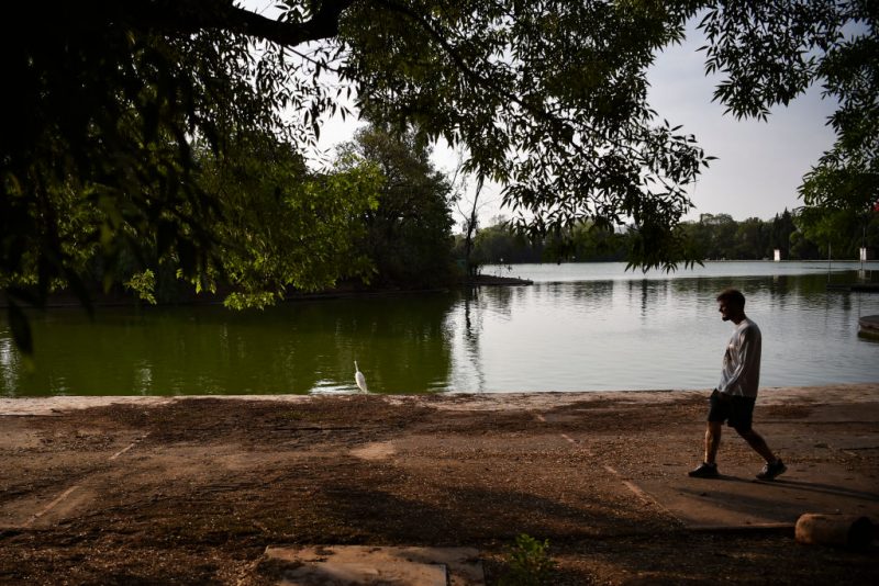 A man walks around Chapultepec's lake in Mexico City on May 30, 2024. (Photo by Rodrigo Oropeza / AFP) (Photo by RODRIGO OROPEZA/AFP via Getty Images)