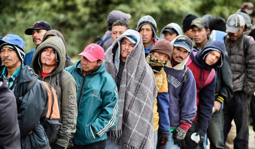 TOPSHOT - Migrants wait to receive food donated by people from the Community Center for Migrant Assistance in the community of Caborca in Sonora state, Mexico, on January 13, 2017. Hundreds of Central American and Mexican migrants attempt to cross the US border daily. (Photo by ALFREDO ESTRELLA / AFP) (Photo by ALFREDO ESTRELLA/AFP via Getty Images)