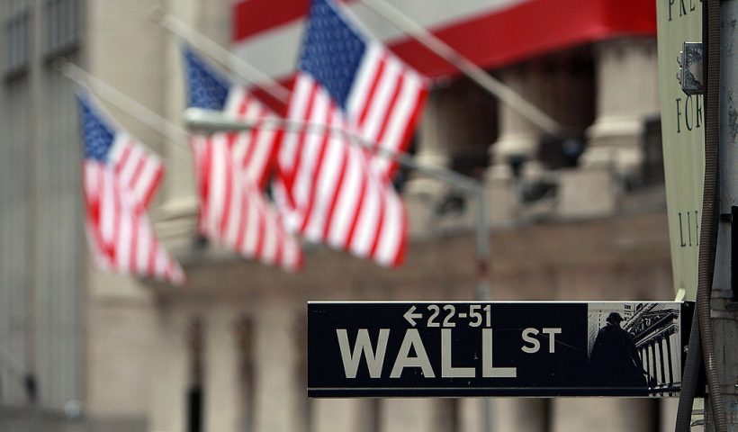 NEW YORK - SEPTEMBER 16: A Wall St. sign next to the New York Stock Exchange (NYSE) September 16, 2008 in New York City. U.S. stocks continued to drop Tuesday morning for the second consecutive day, following yesterday's Dow Jones Industrial Average plunge of 4.4% or 504 points, being the worst single day loss since the terrorist attacks of September 2001. Today the Federal Reserve is scheduled to announce the target interest rates for the federal funds. It's not clear how the central bank will respond to recent turmoil in the world's financial markets. This comes after news of Merrill Lynch & Co. Inc selling itself to Bank of America Corp, the financial firm Lehman Brothers Holdings Inc. filing for Chapter 11 bankruptcy protection, and insurance giant American International Group Inc. (AIG) attempting to raise capital to stay afloat. (Photo by Spencer Platt/Getty Images)