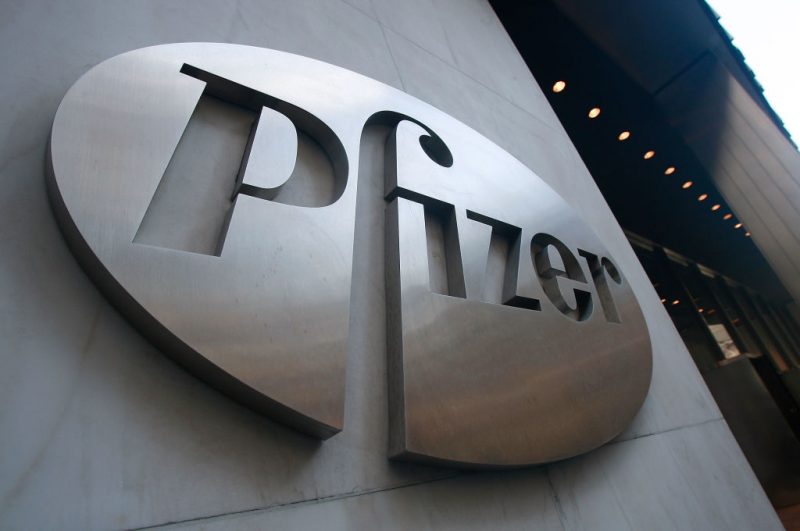 NEW YORK - JANUARY 26: A Pfizer sign hangs on the outside of their headquarters after a news conference discussing the planned merger of Pfizer and Wyeth January 26, 2009 in New York City. Pfizer plans to acquire Wyeth for $68 billion creating the world's largest biopharmaceutical company. (Photo by Mario Tama/Getty Images)