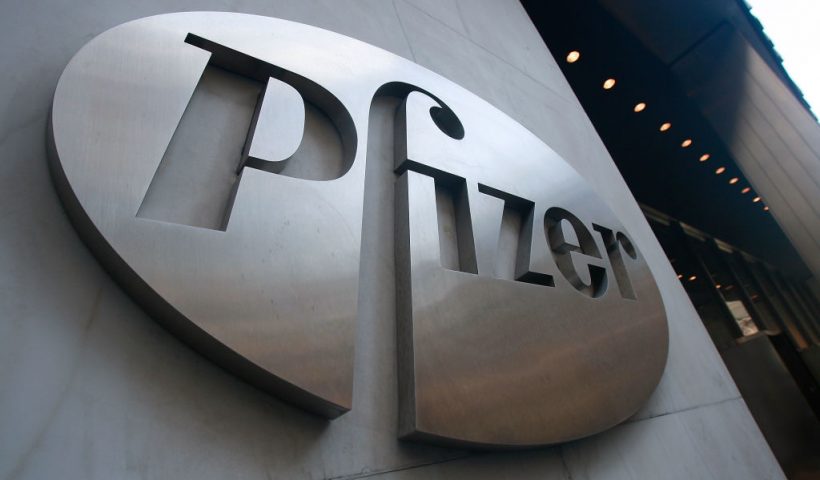 NEW YORK - JANUARY 26: A Pfizer sign hangs on the outside of their headquarters after a news conference discussing the planned merger of Pfizer and Wyeth January 26, 2009 in New York City. Pfizer plans to acquire Wyeth for $68 billion creating the world's largest biopharmaceutical company. (Photo by Mario Tama/Getty Images)