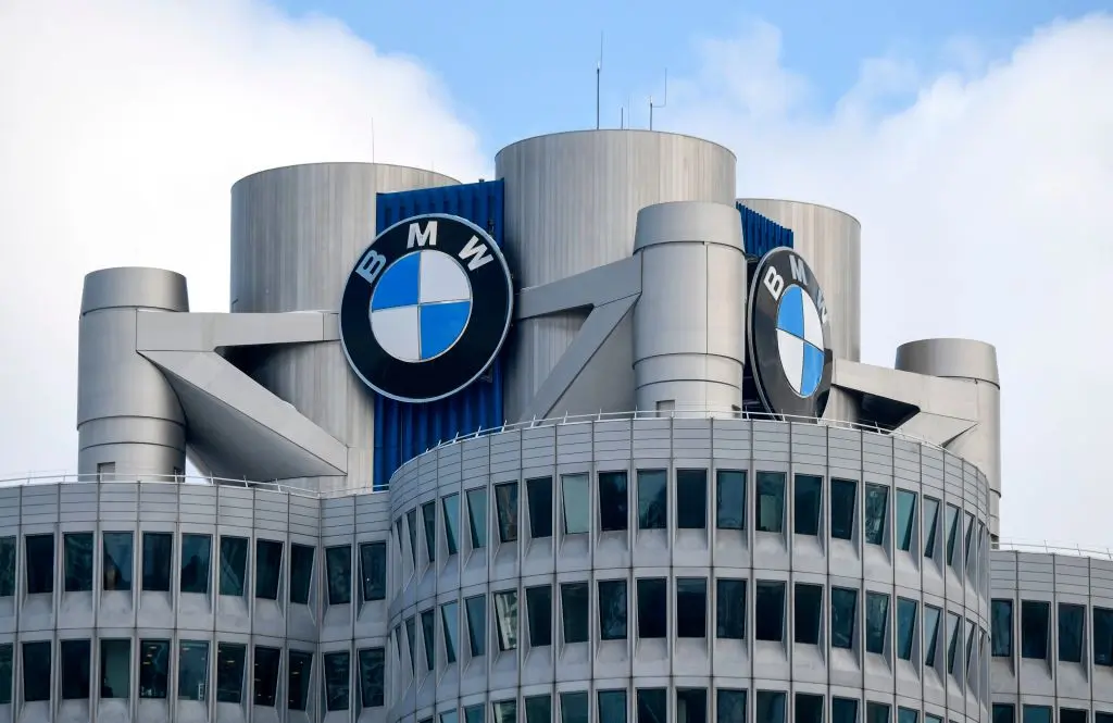 The BMW logo is seen on the top of the headquarters of German carmaker BMW in Munich on March 20, 2018.
