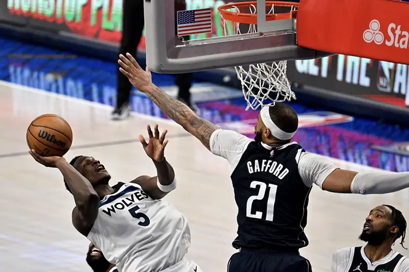 Minnesota Timberwolves guard Anthony Edwards (5) shoots over Dallas Mavericks center Daniel Gafford (21) during the second half in game four of the western conference finals for the 2024 NBA playoffs at American Airlines Center. Mandatory Credit: Jerome Miron-USA TODAY Sports