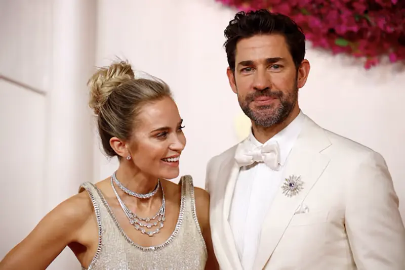 Emily Blunt and John Krasinski pose on the red carpet during the Oscars arrivals at the 96th Academy Awards in Hollywood, Los Angeles, California, U.S., March 10, 2024. REUTERS/Sarah Meyssonnier/File Photo