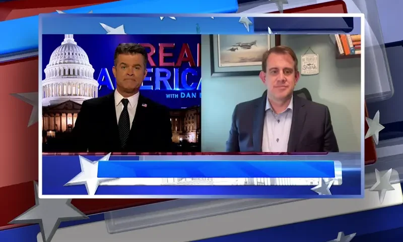 Video still from Real America on One America News Network showing a split screen of the host on the left side, and on the right side is the guest, Jesse Binnall.
