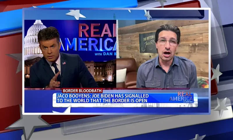 Video still from Real America on One America News Network showing a split screen of the host on the left side, and on the right side is the guest, Jaco Booyens.