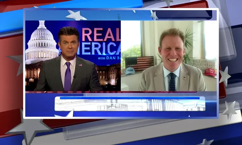 Video still from Real America on One America News Network showing a split screen of the host on the left side, and on the right side is the guest, Andrew Giuliani.
