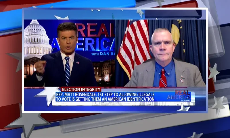 Video still from Real America on One America News Network showing a split screen of the host on the left side, and on the right side is the guest, Rep. Matt Rosendale.