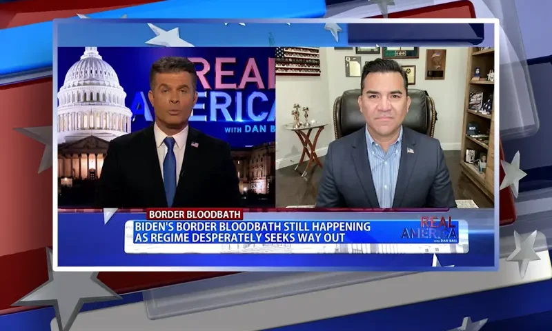 Video still from Real America on One America News Network showing a split screen of the host on the left side, and on the right side is the guest, Victor Avila.