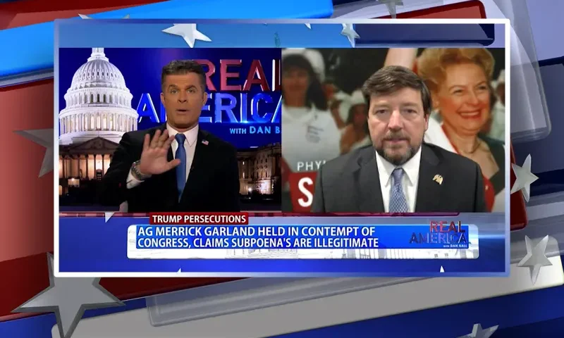 Video still from Real America on One America News Network showing a split screen of the host on the left side, and on the right side is the guest, Ed Martin.