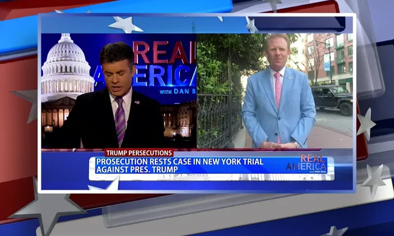 Video still from Real America on One America News Network showing a split screen of the host on the left side, and on the right side is the guest, Andrew Giuliani.